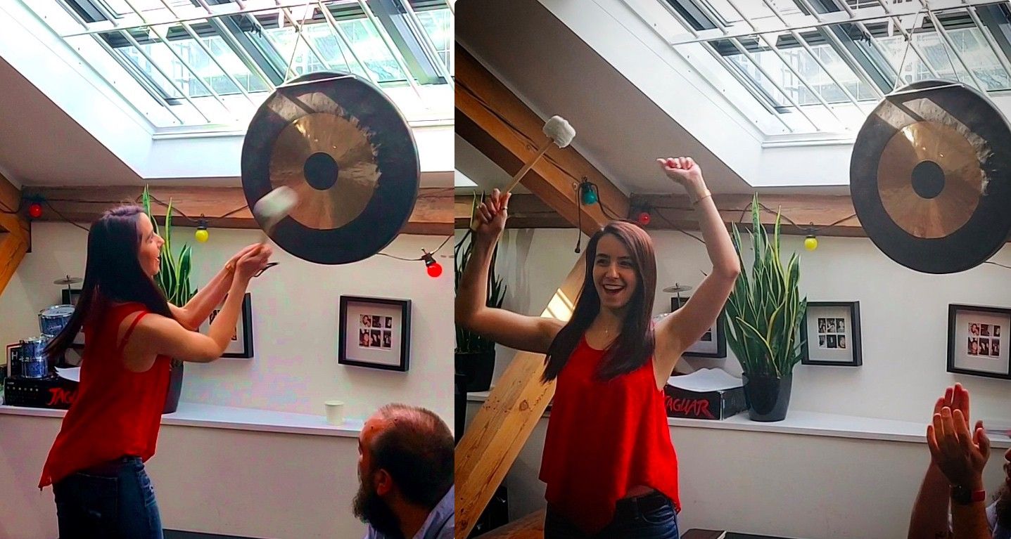 Debora hits a gong to celebrate getting her first job