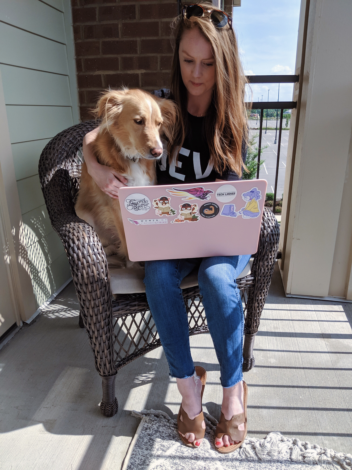 Kara with her laptop and dog